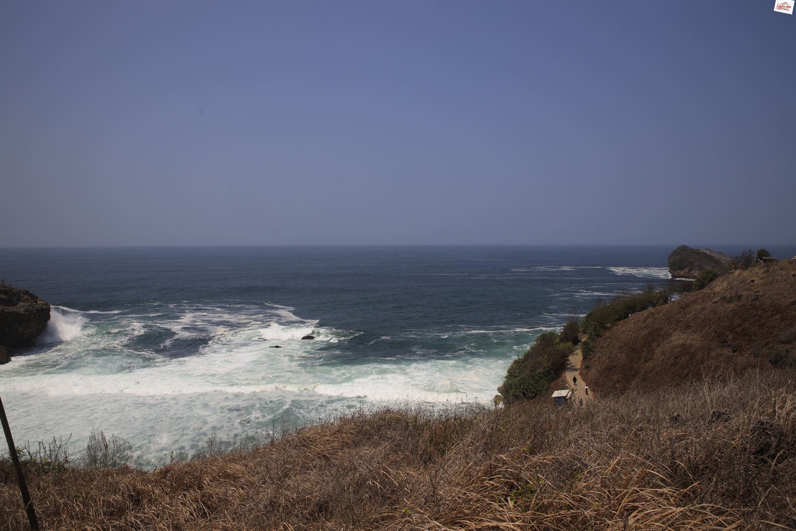 The Indian Ocean from the hills around Kasap, with waves breaking below the slope